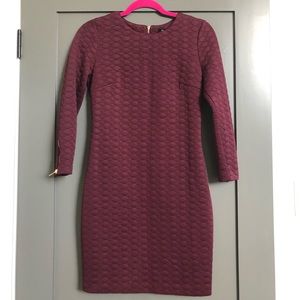 Burgundy dynamite dress with gold zipper detailed. Worn once.